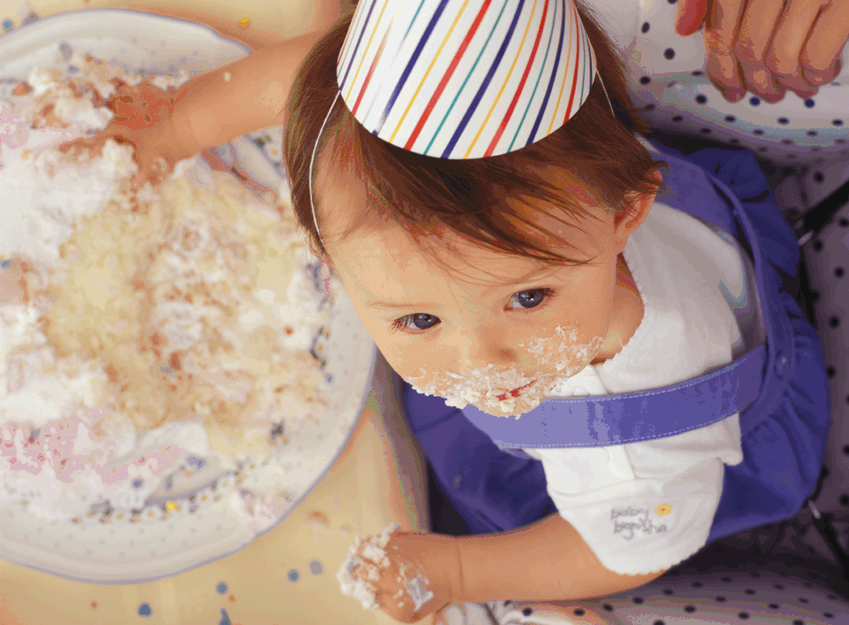 Picture of a baby eating cake