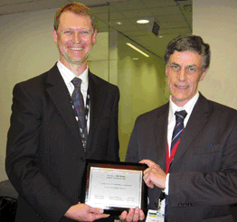 Carl Obst (ABS) presents Vin Martin (retiring VSAF Chair) with a plaque recognising his statistical contribution to Victoria.
