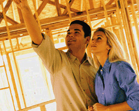 Two people in a house under construction