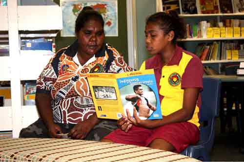 Image: Cherbourg girl reading with elder.
