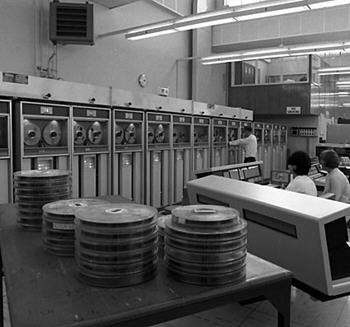 Census computing, 1966 - an office with computer reels in foreground, and banks of computers