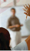 Image of student raising their hand to ask the teacher a question