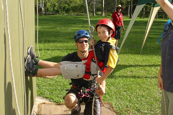 Photograph: Cub Scout and leader abseiling – courtesy Nick Politylo.