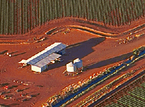 Aerial view of farm sheds and silos