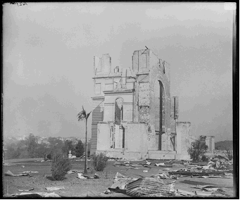 Photo of a few standing parts of the Garden Palace building after it was destroyed by fire