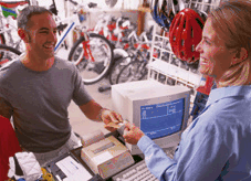  Image: A businesswoman serving a customer in a bicycle shop