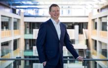 Sean Crick wide shot on a balcony