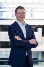 Sean Crick wide photo on a balcony