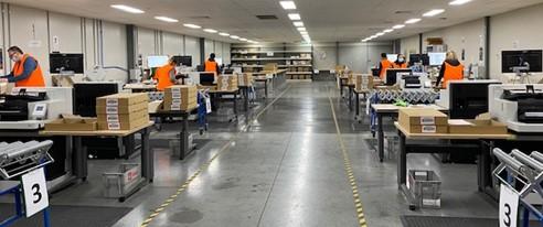 Photo of Census staff scanning forms