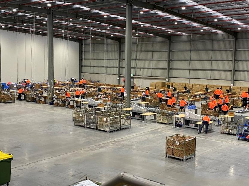 Photo of warehouse with Census staff working