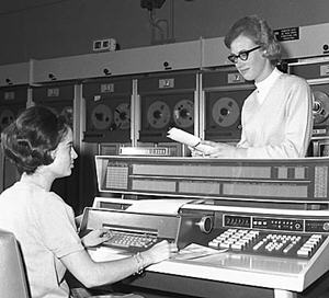 Two women staff in the computing room